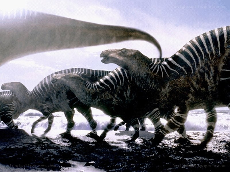dinosaurs running on beach