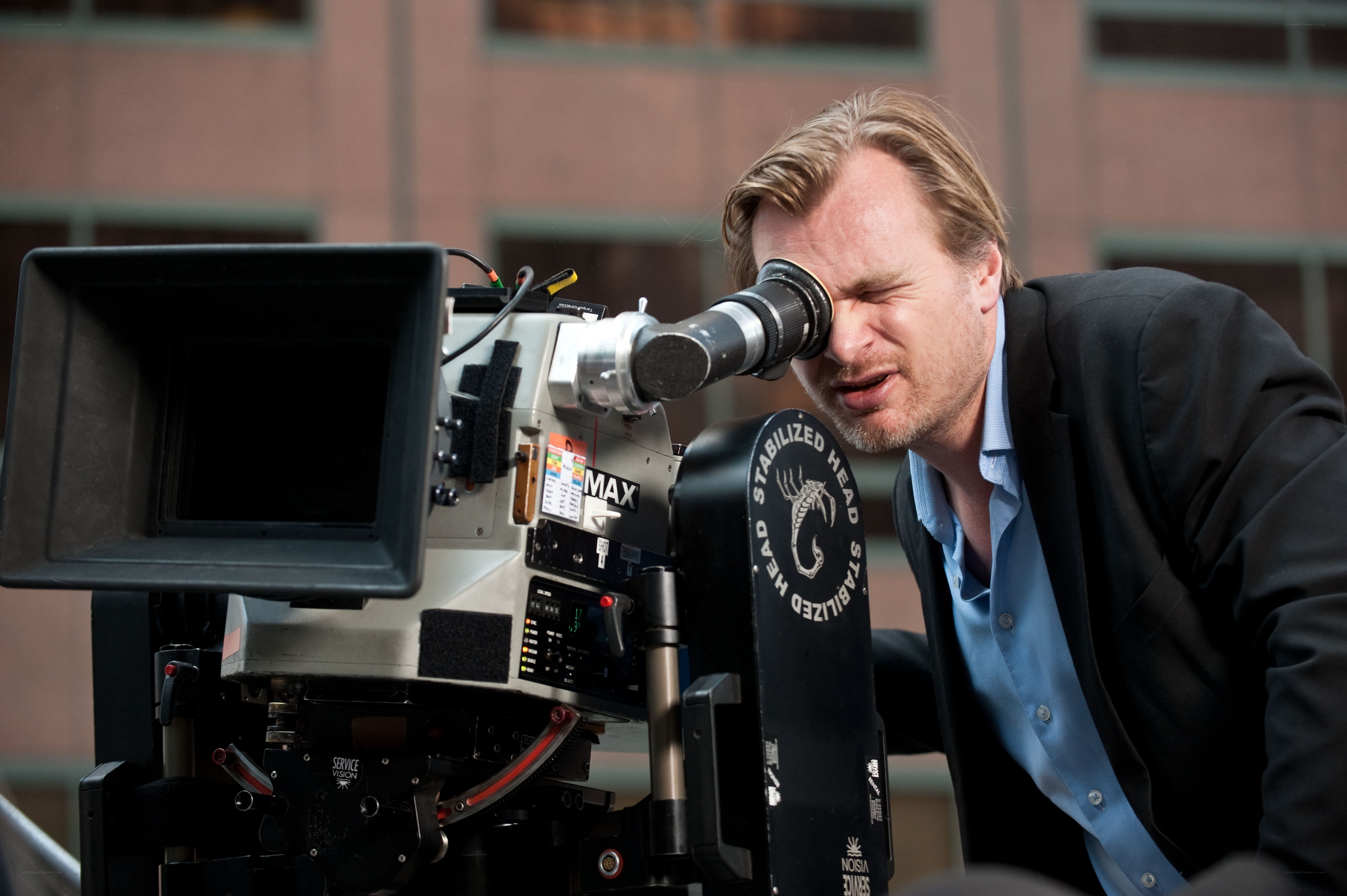 Director filming with camera