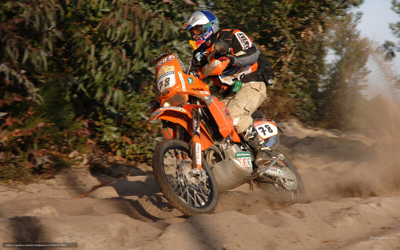 Dirt bike racer on sandy track