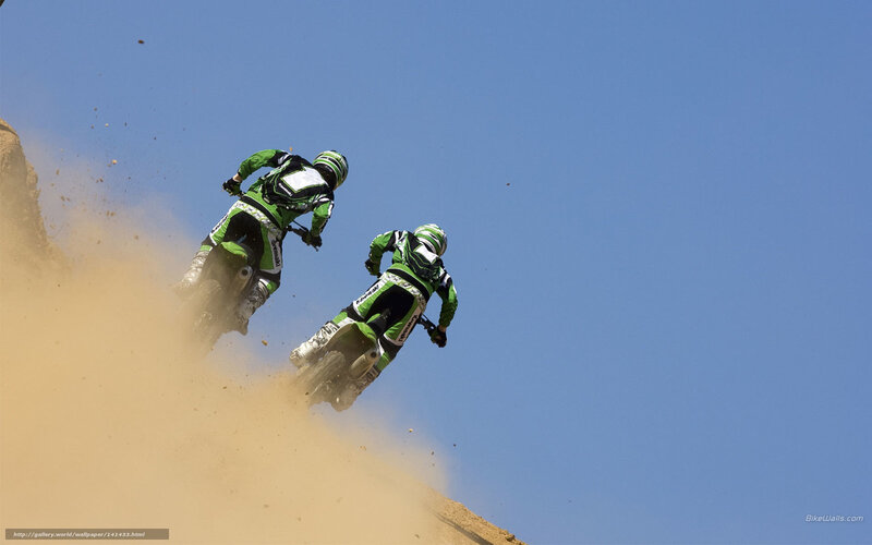 Dirt bike riders on a hill