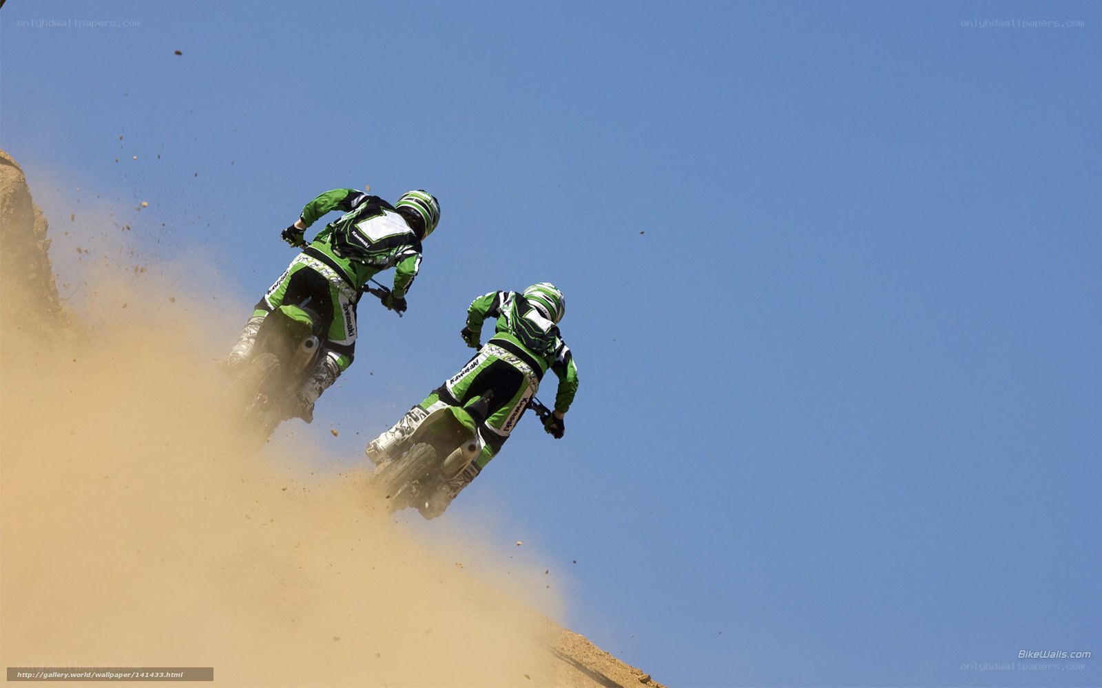 Dirt bike riders on a hill