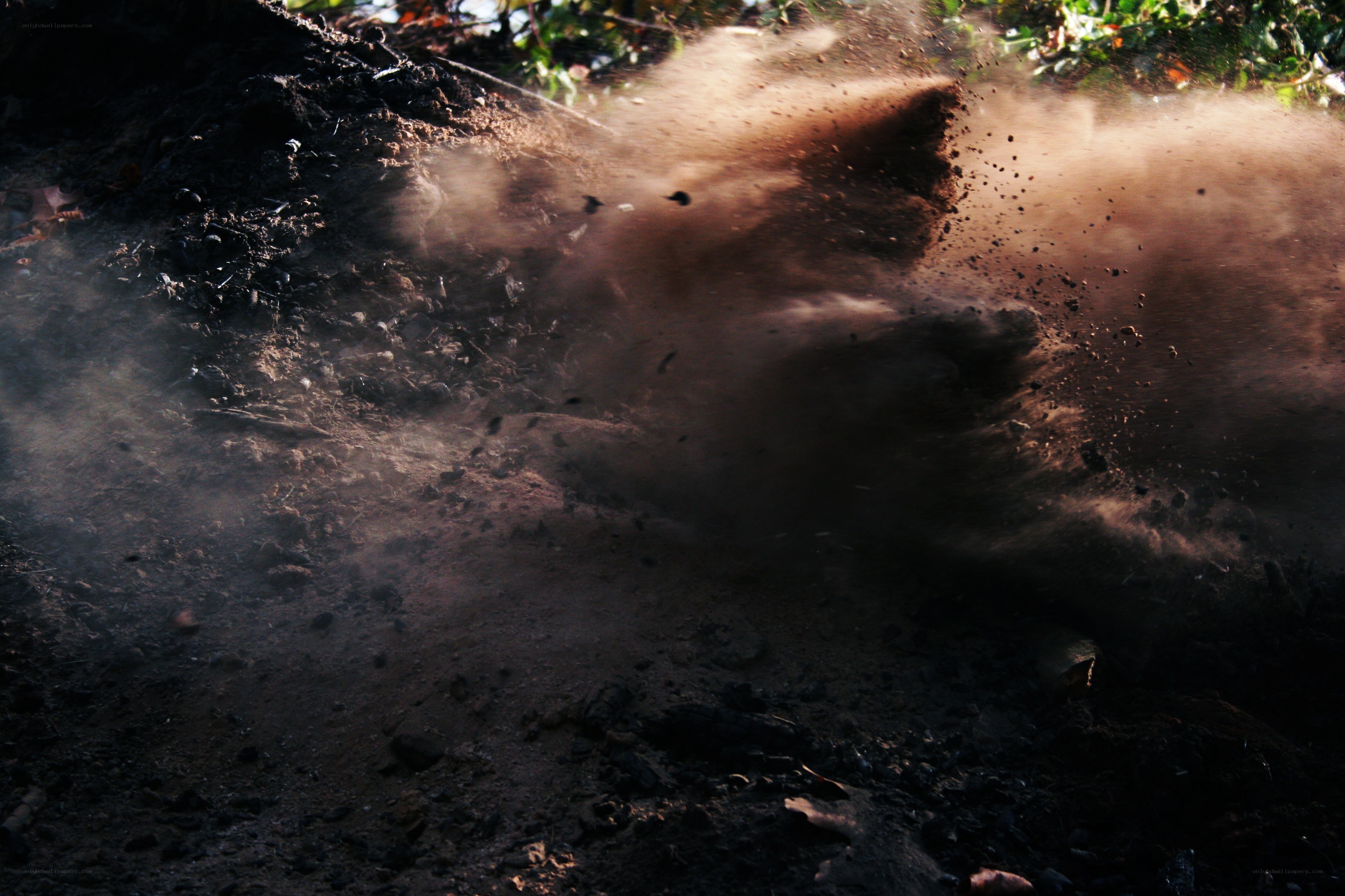 dirt kicked up by vehicle