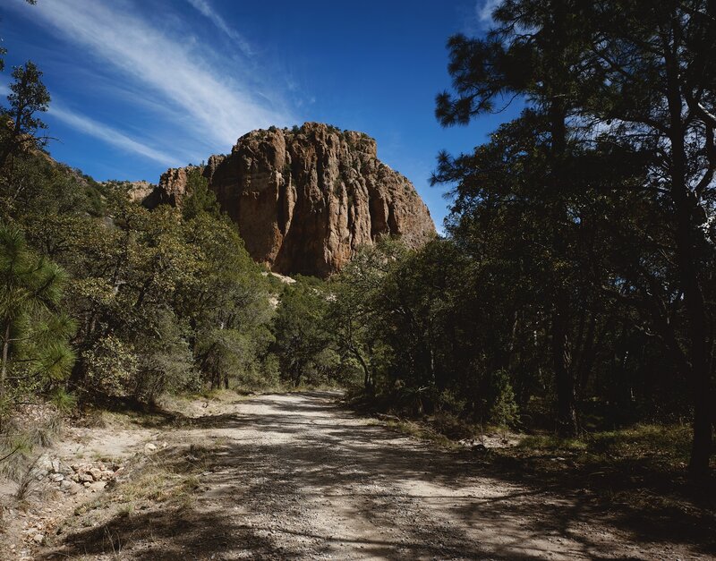 Dirt path leading to a rocky cliff