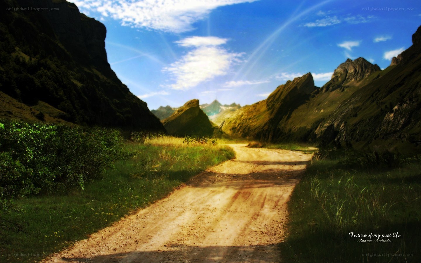 Dirt path through mountain valley