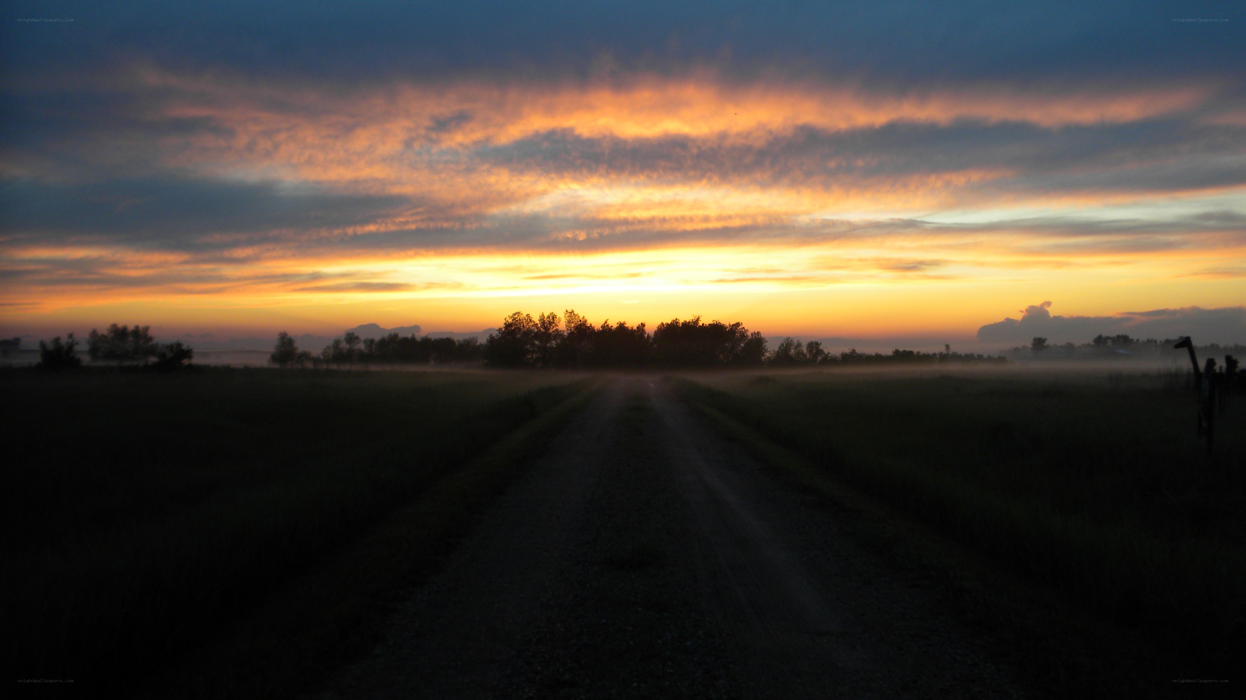 Dirt road at sunrise