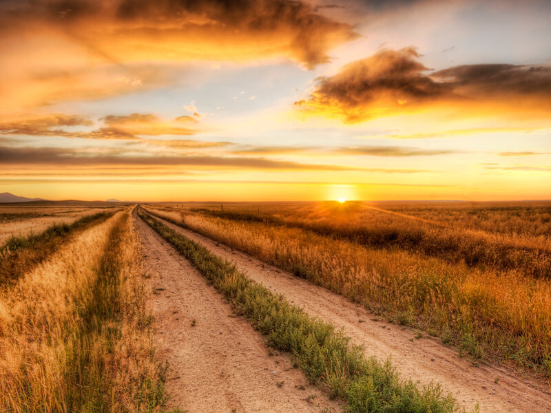 Dirt road at sunset