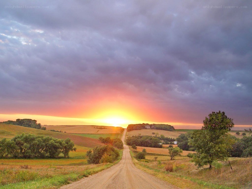 Dirt road at sunset