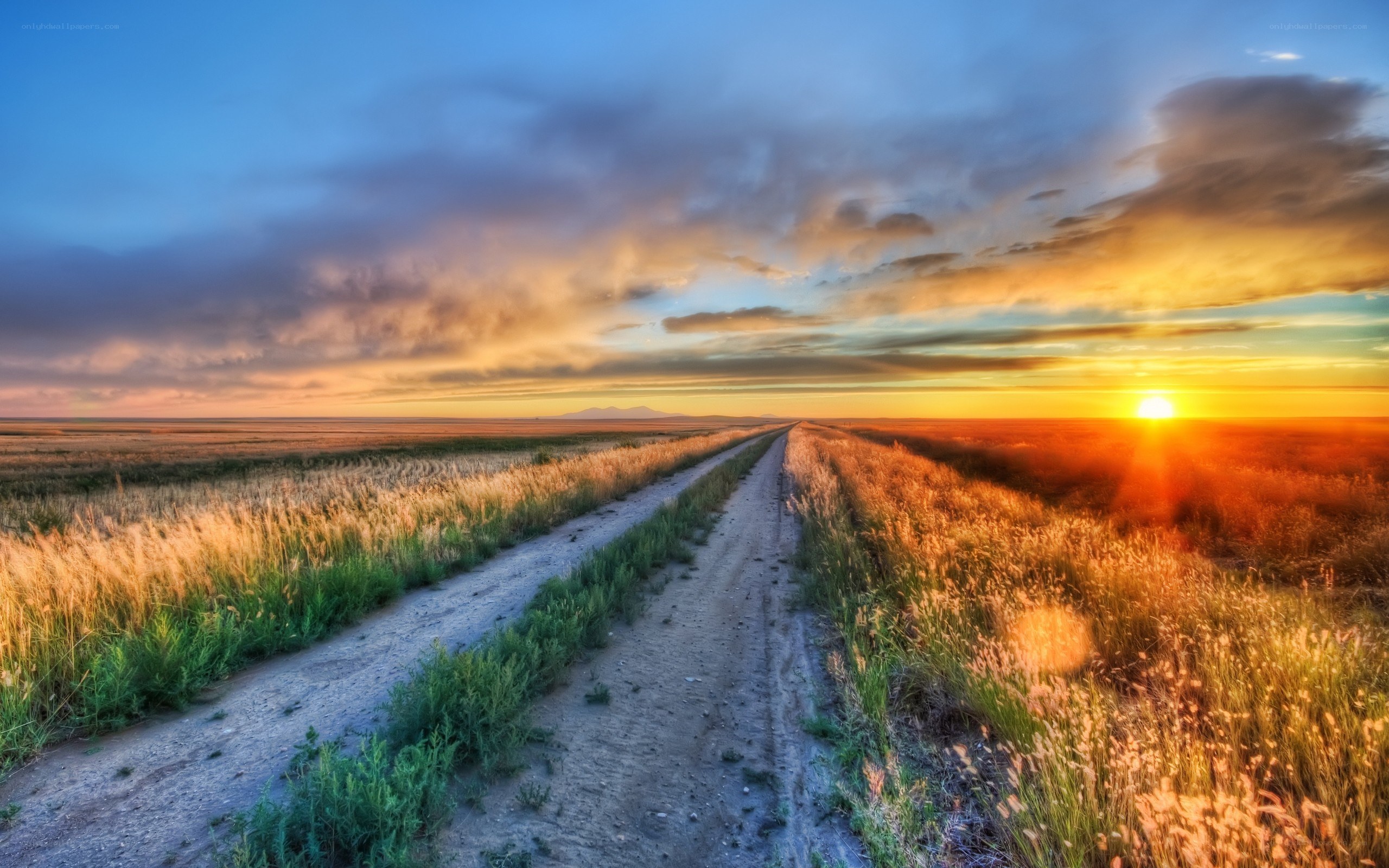 Dirt road at sunset