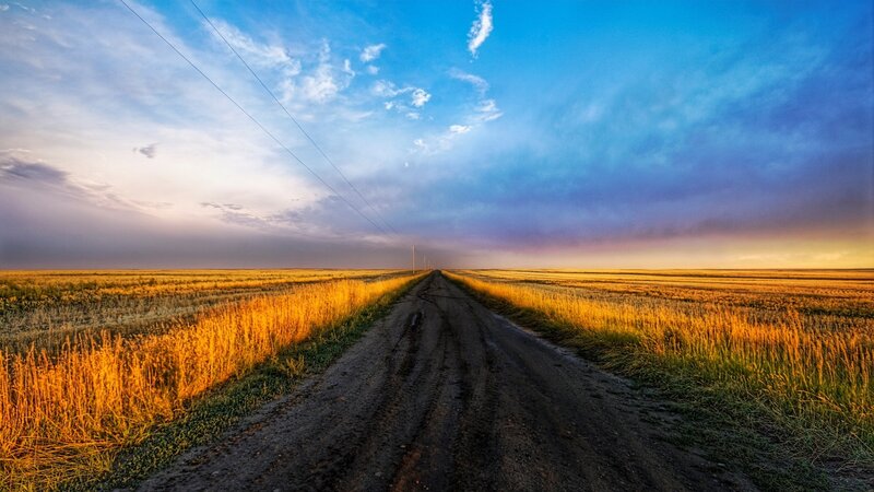 Dirt Road in Field — Blue, Serene, Sunset, Photograph, Sky, Power Lines