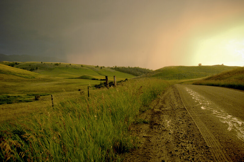 Dirt road in green hills