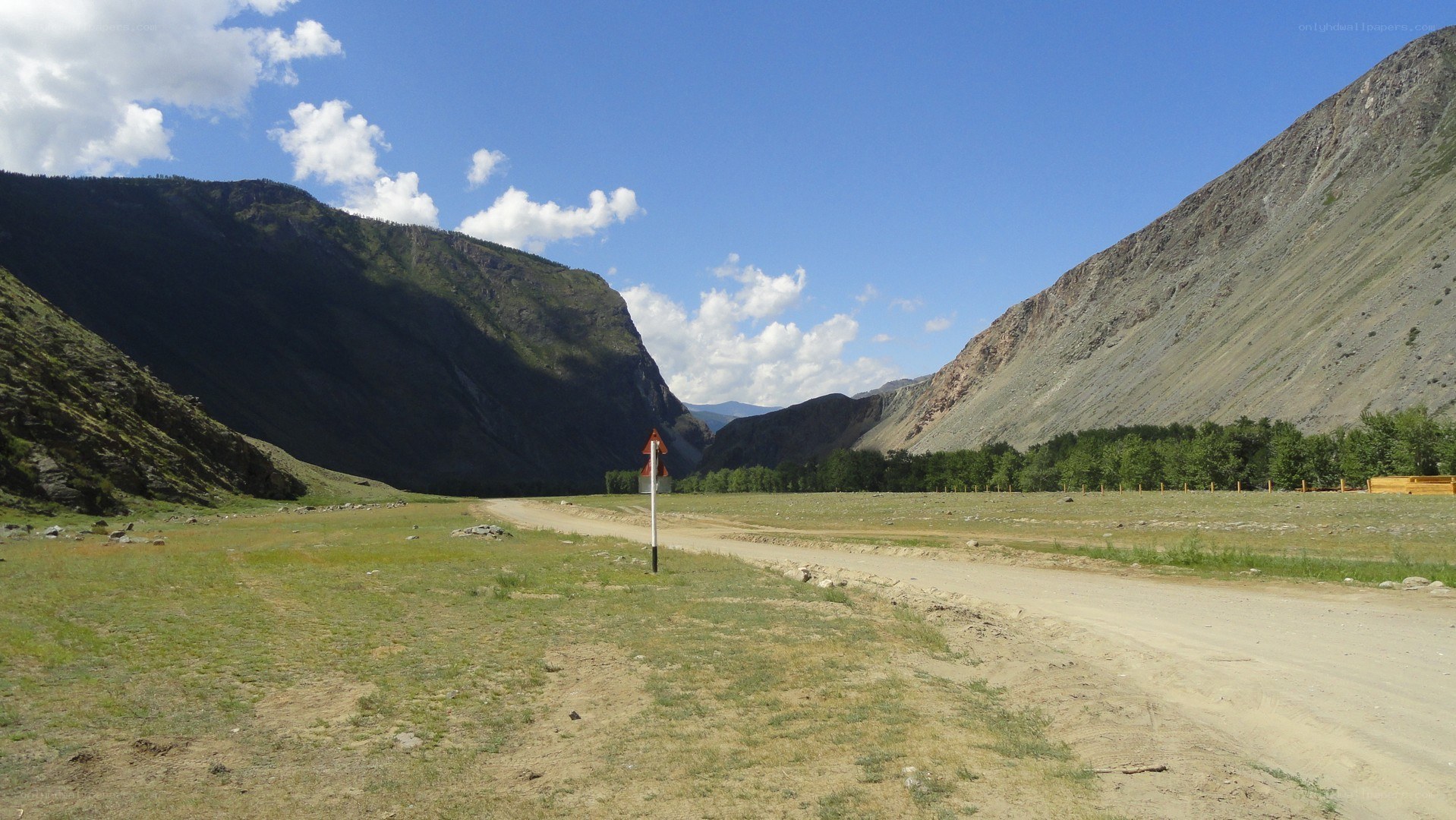 Dirt road in mountain valley