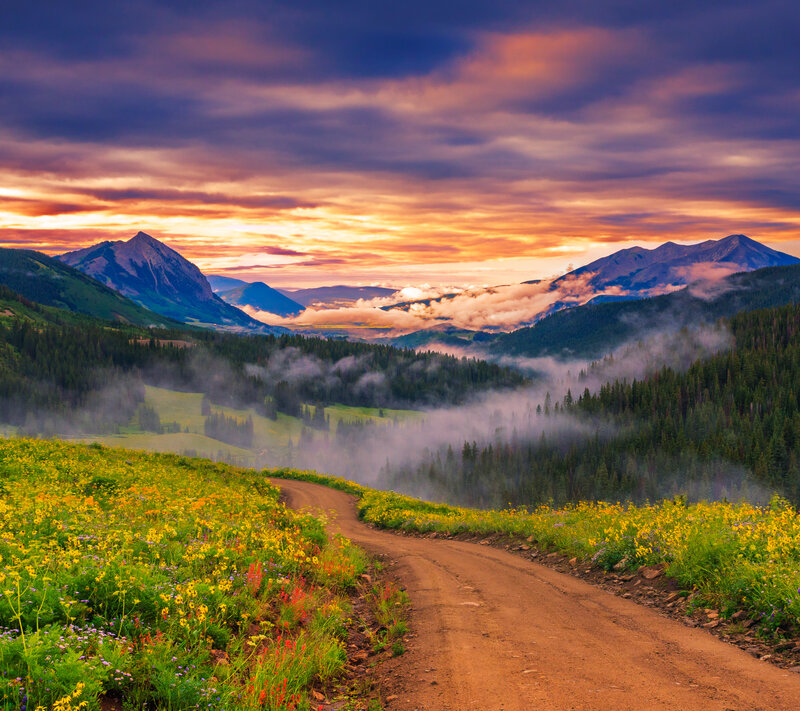 Dirt Road in Mountain Valley — Yellow, Serene, Sunrise, Photograph