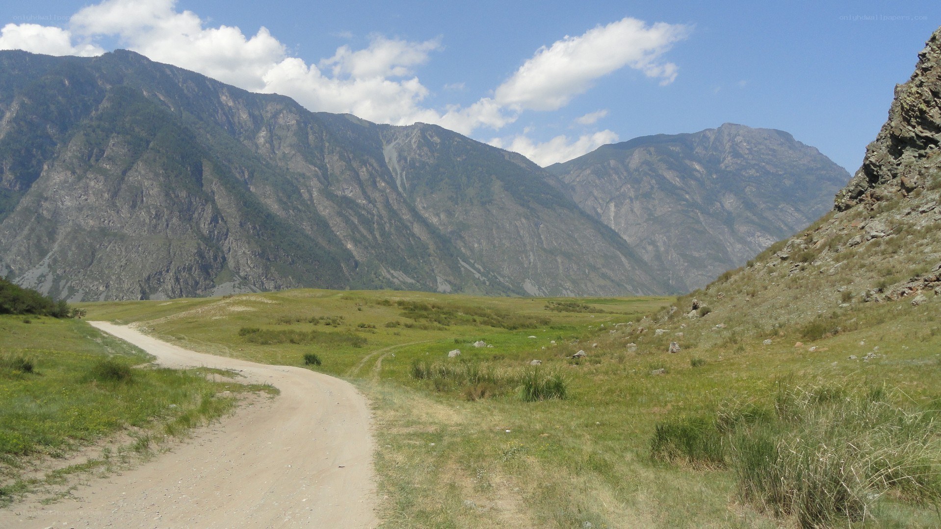Dirt road in mountain valley