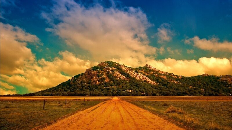 Dirt road leading to a hill