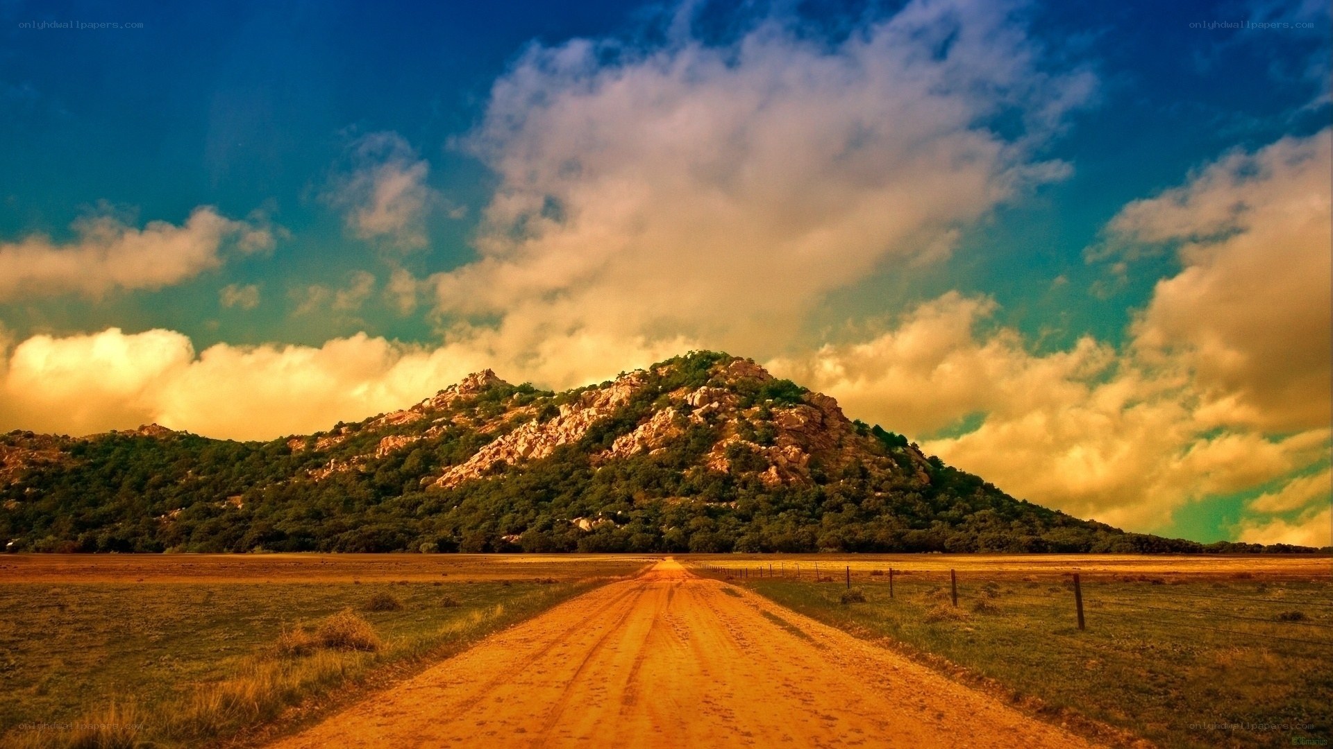 Dirt road leading to a mountain