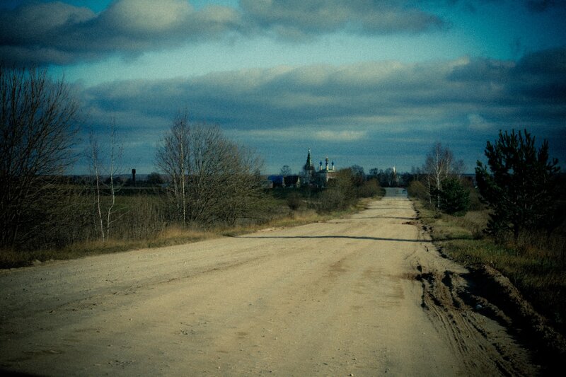 Dirt road leading to a village