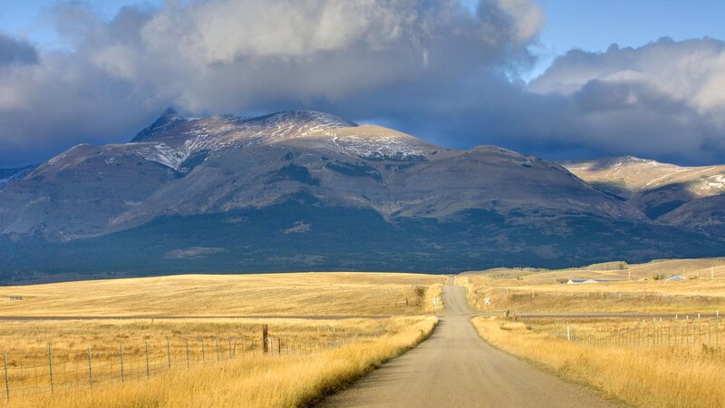 Dirt road leading to mountains