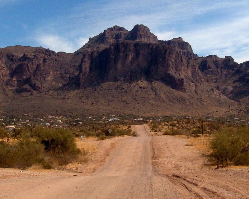 Dirt Road Leading to Mountains — Brown