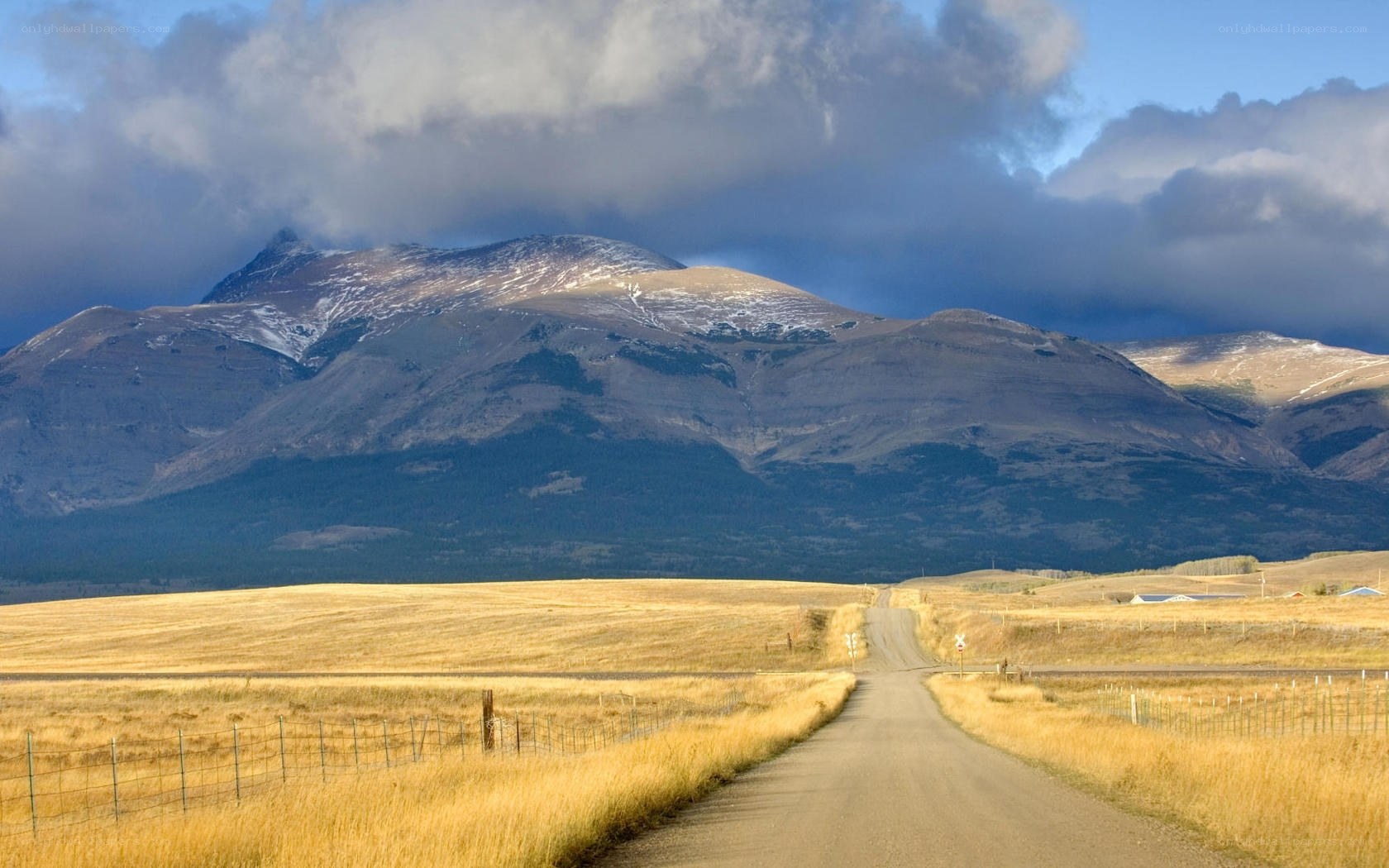 Dirt road leading to mountains