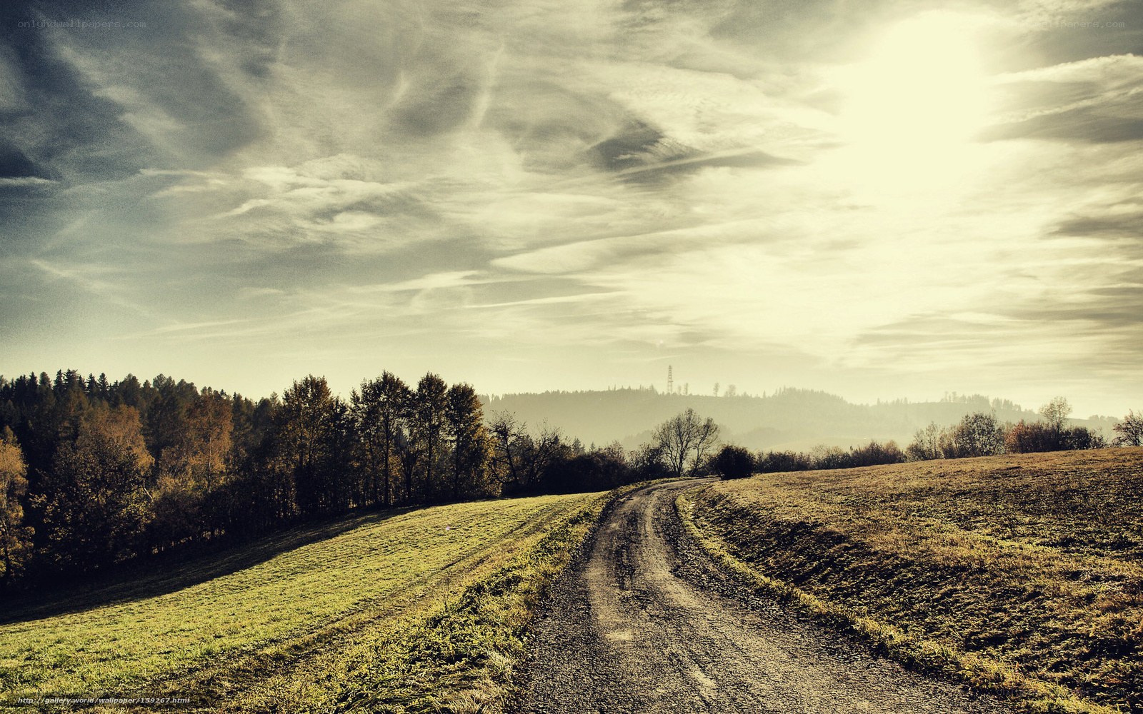 Dirt road through autumn hills