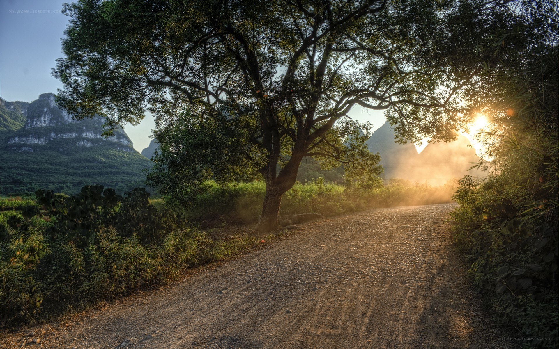 Dirt road through mountain valley