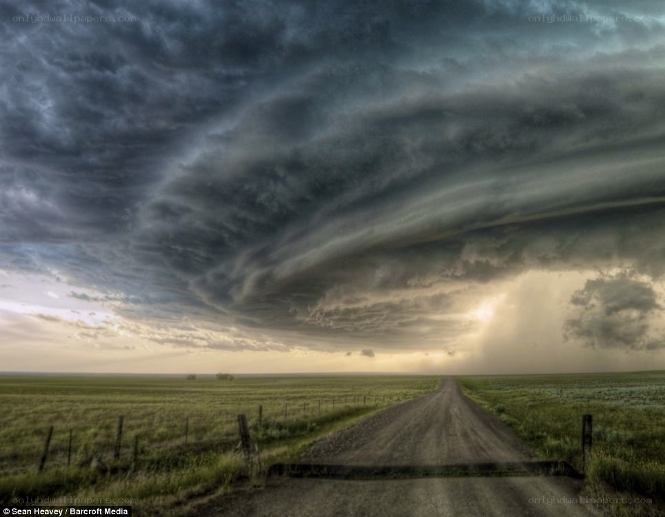 Dirt road under storm clouds