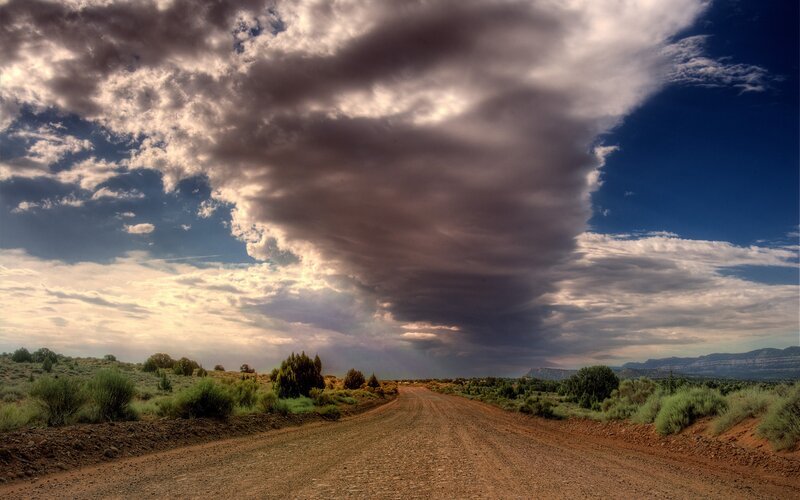 Dirt Road under Storm Clouds — Brown, Dramatic