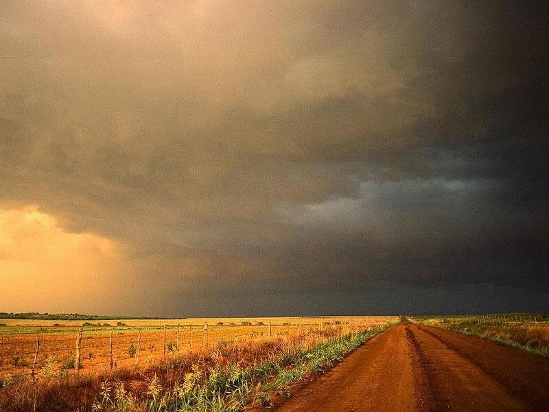 Dirt Road under Storm Clouds — Brown