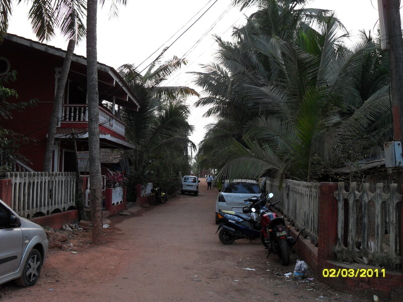Dirt Road with Parked Vehicles