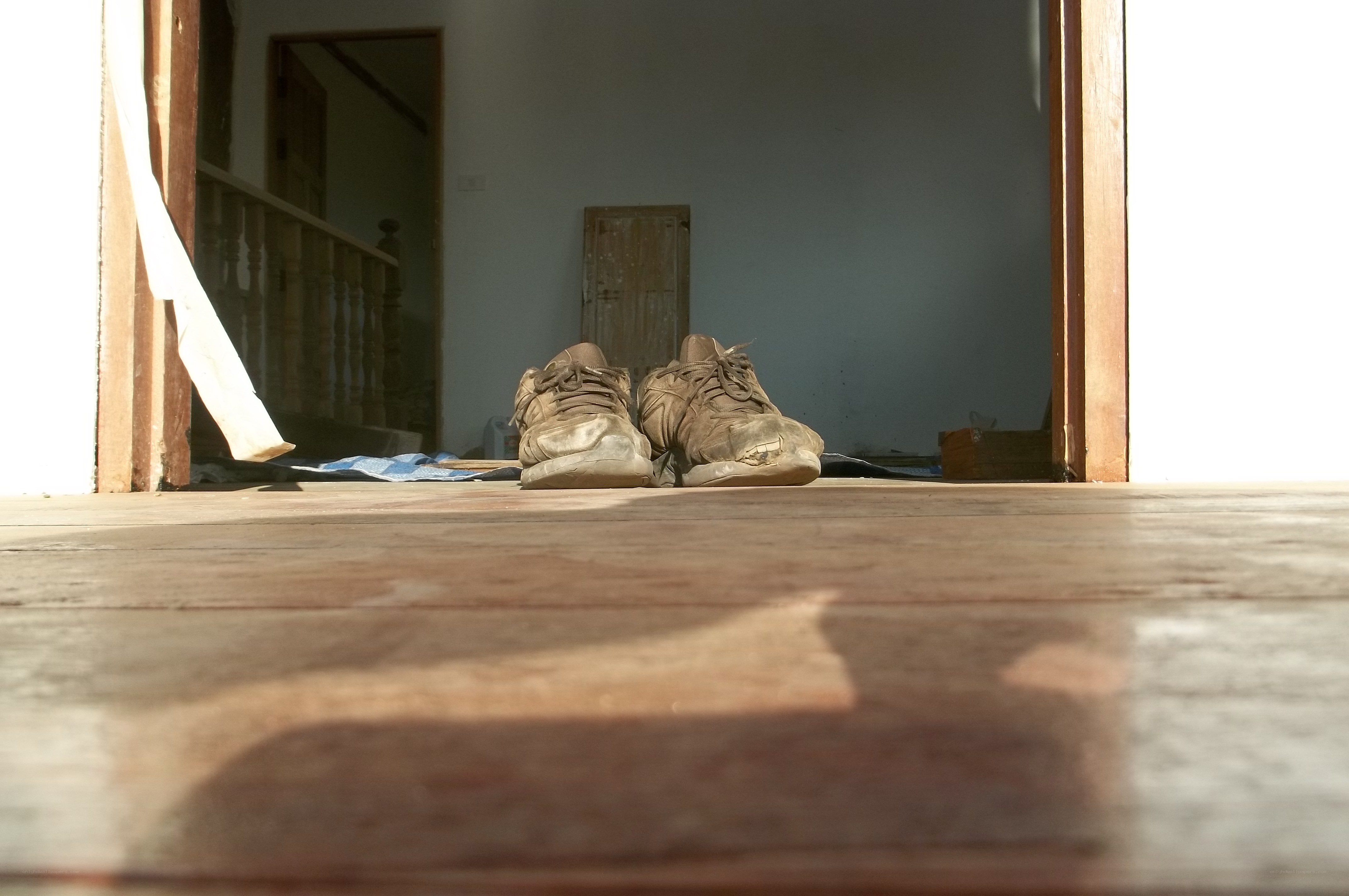 Dirty shoes in a doorway