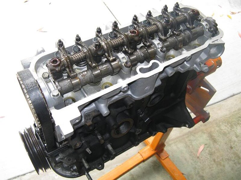 disassembled car engine on stand