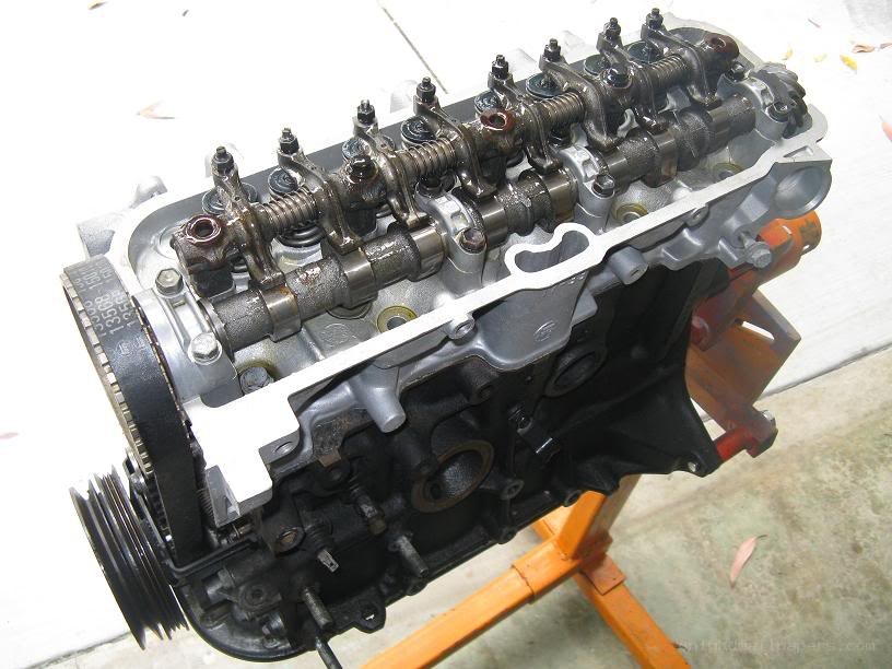 disassembled car engine on stand