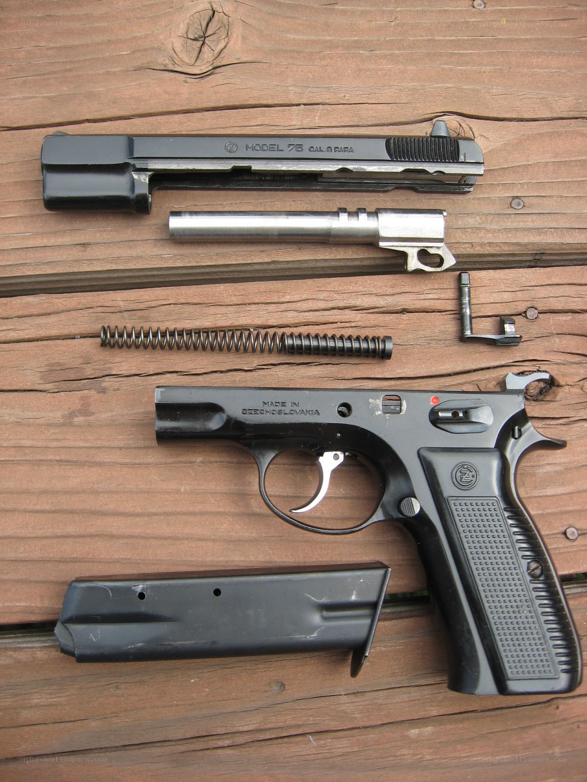 disassembled pistol parts