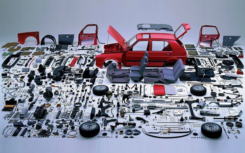 Disassembled red car components
