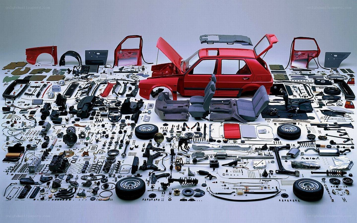 Disassembled red car components