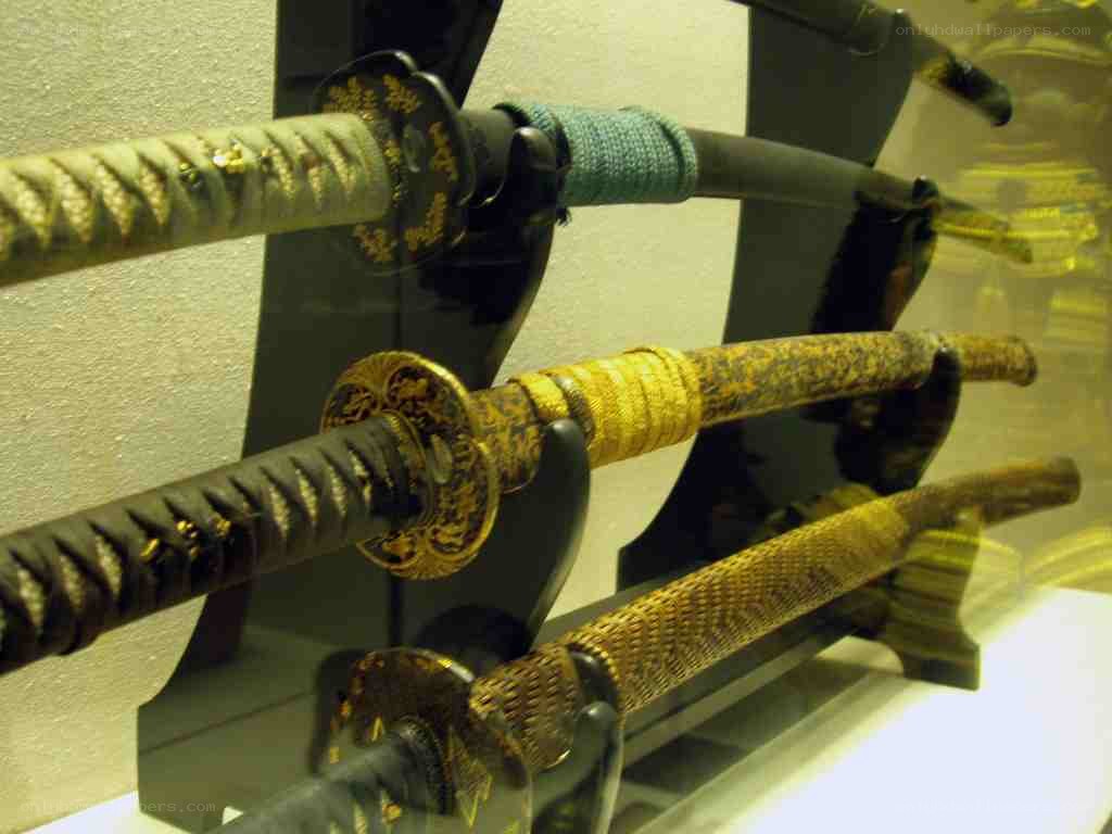 display of ornate katanas
