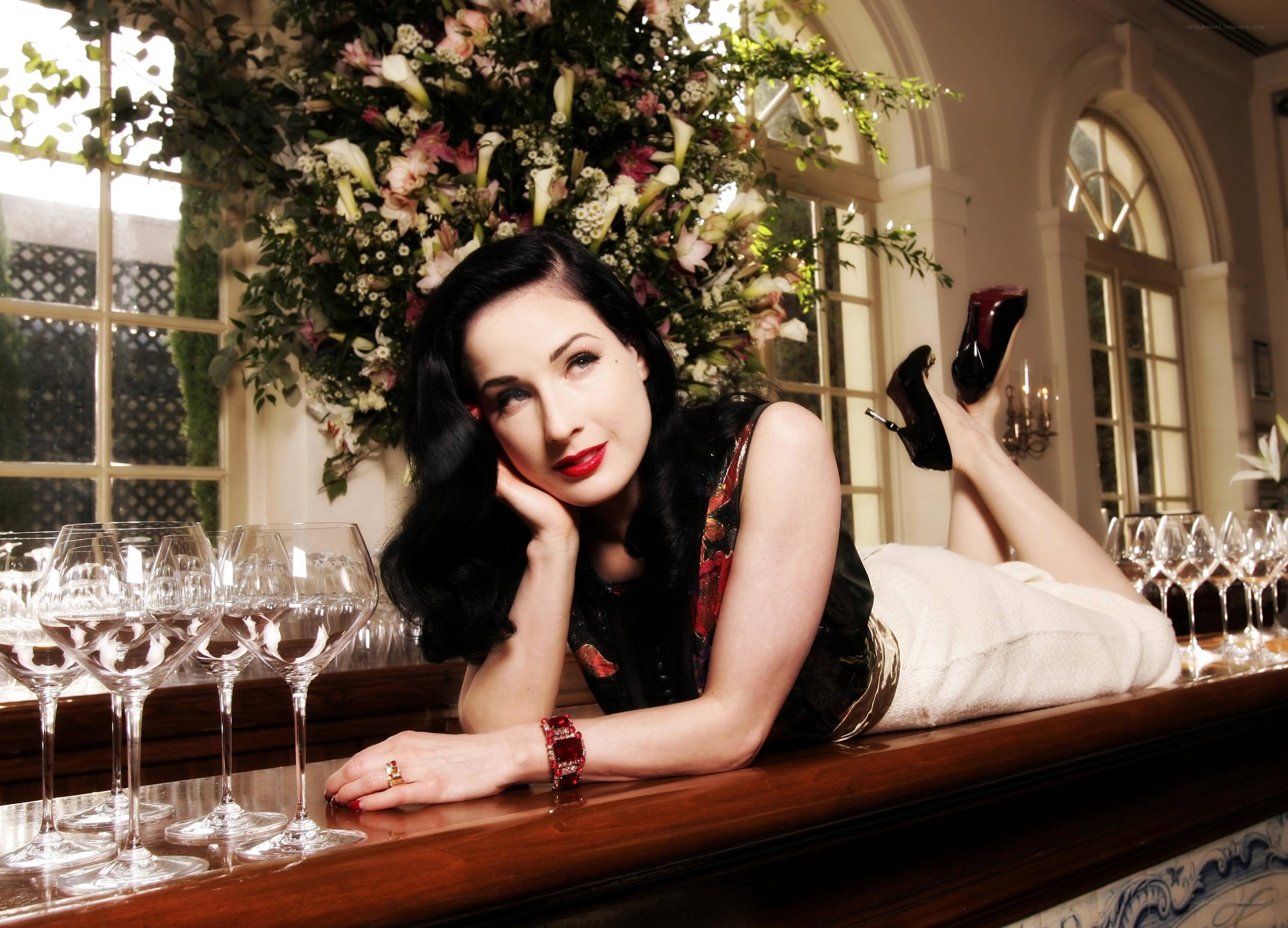 Dita Von Teese at a bar