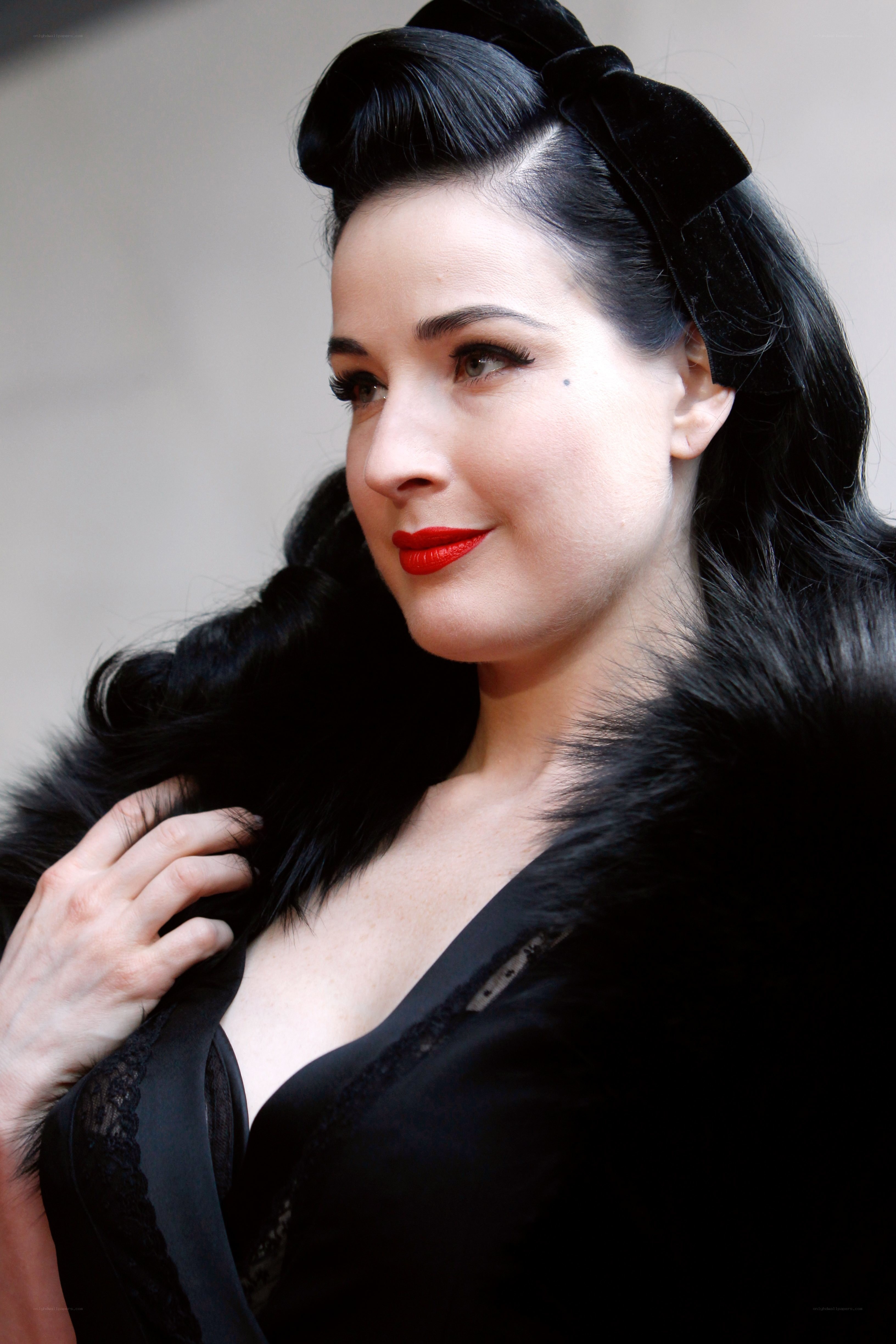 Dita Von Teese in black fur coat