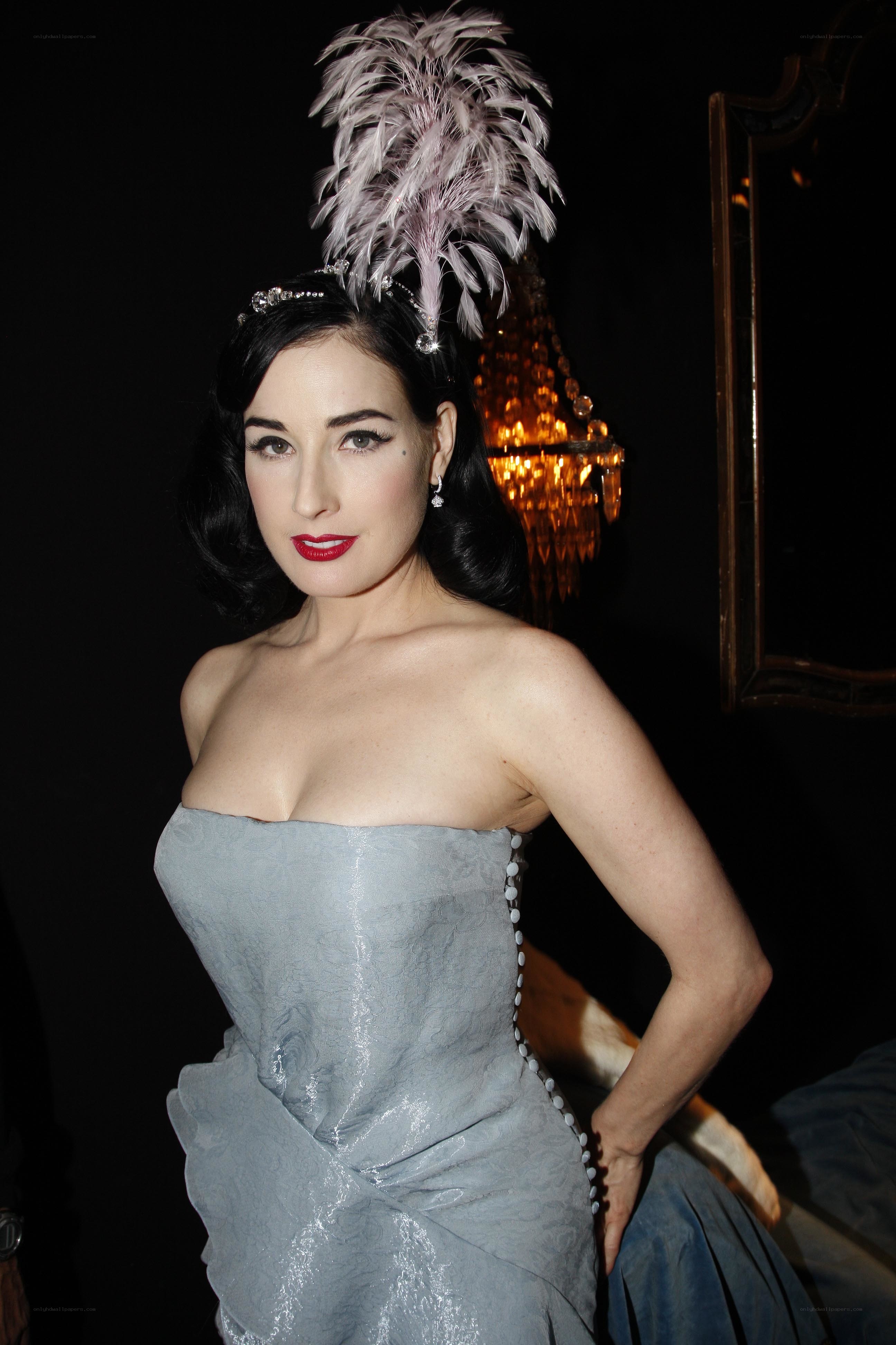 Dita Von Teese in feathered headpiece