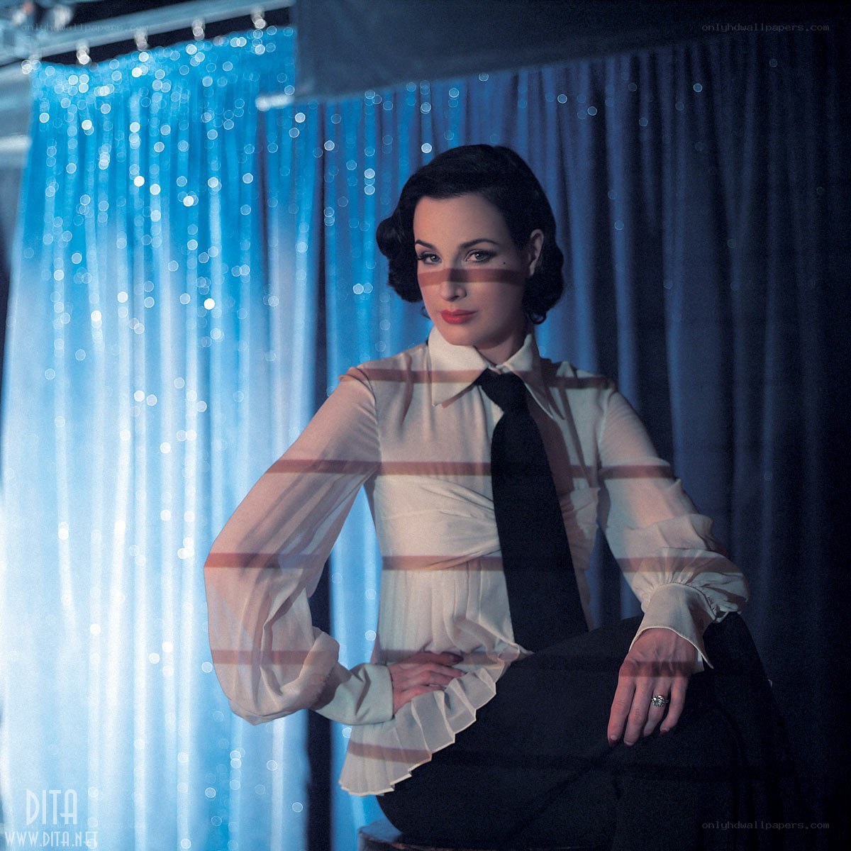 Dita Von Teese in striped blouse