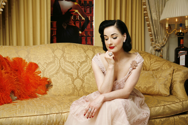 Dita Von Teese on a sofa