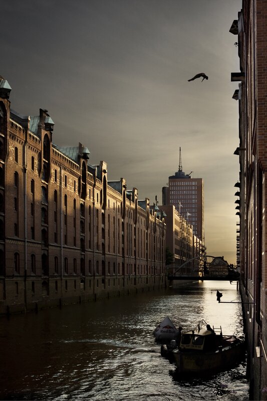 Diver above canal at dusk