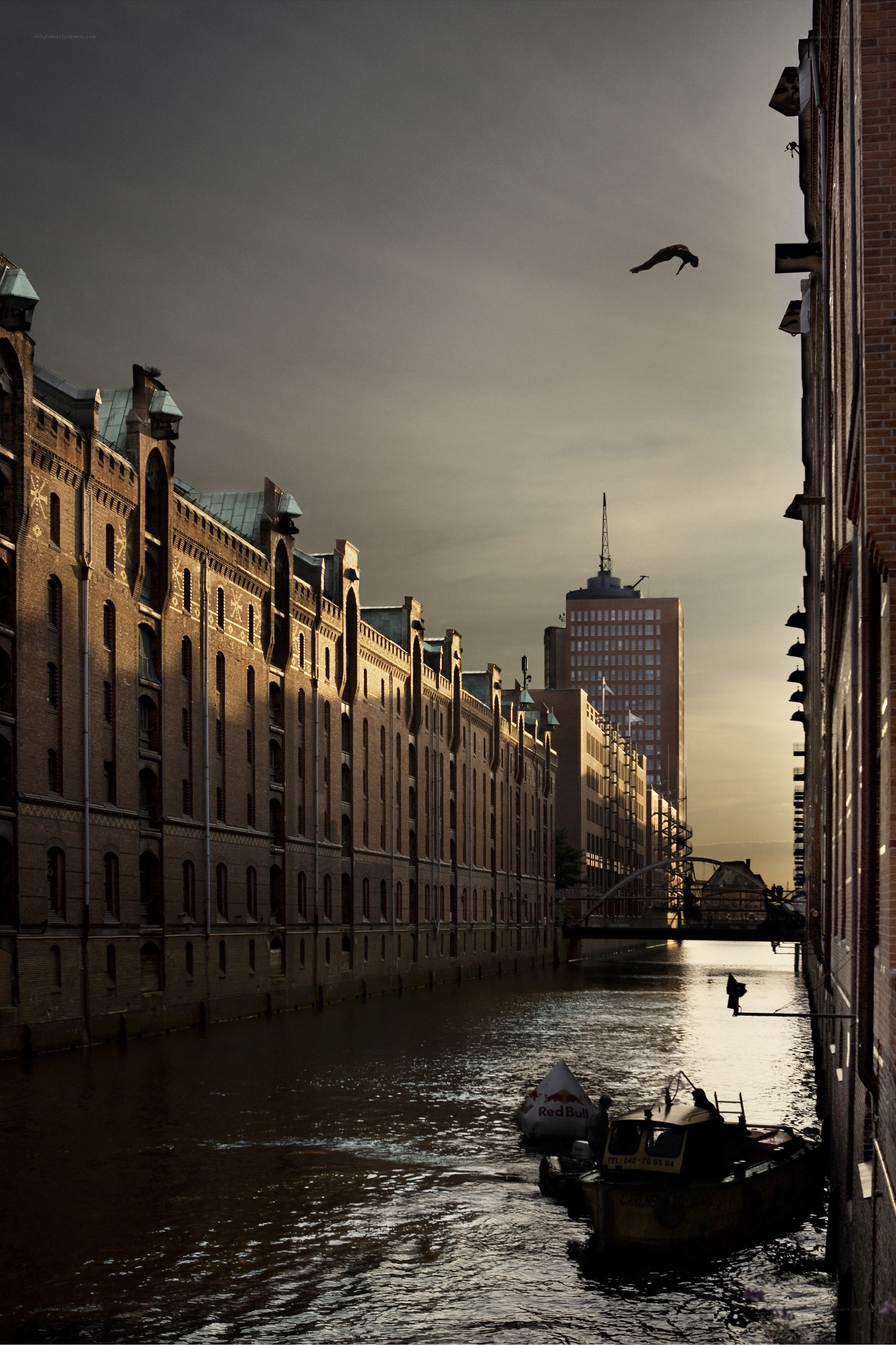 Diver above canal at dusk