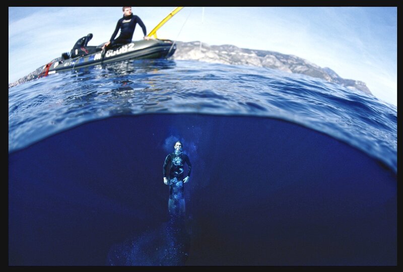 Diver and boat on the water