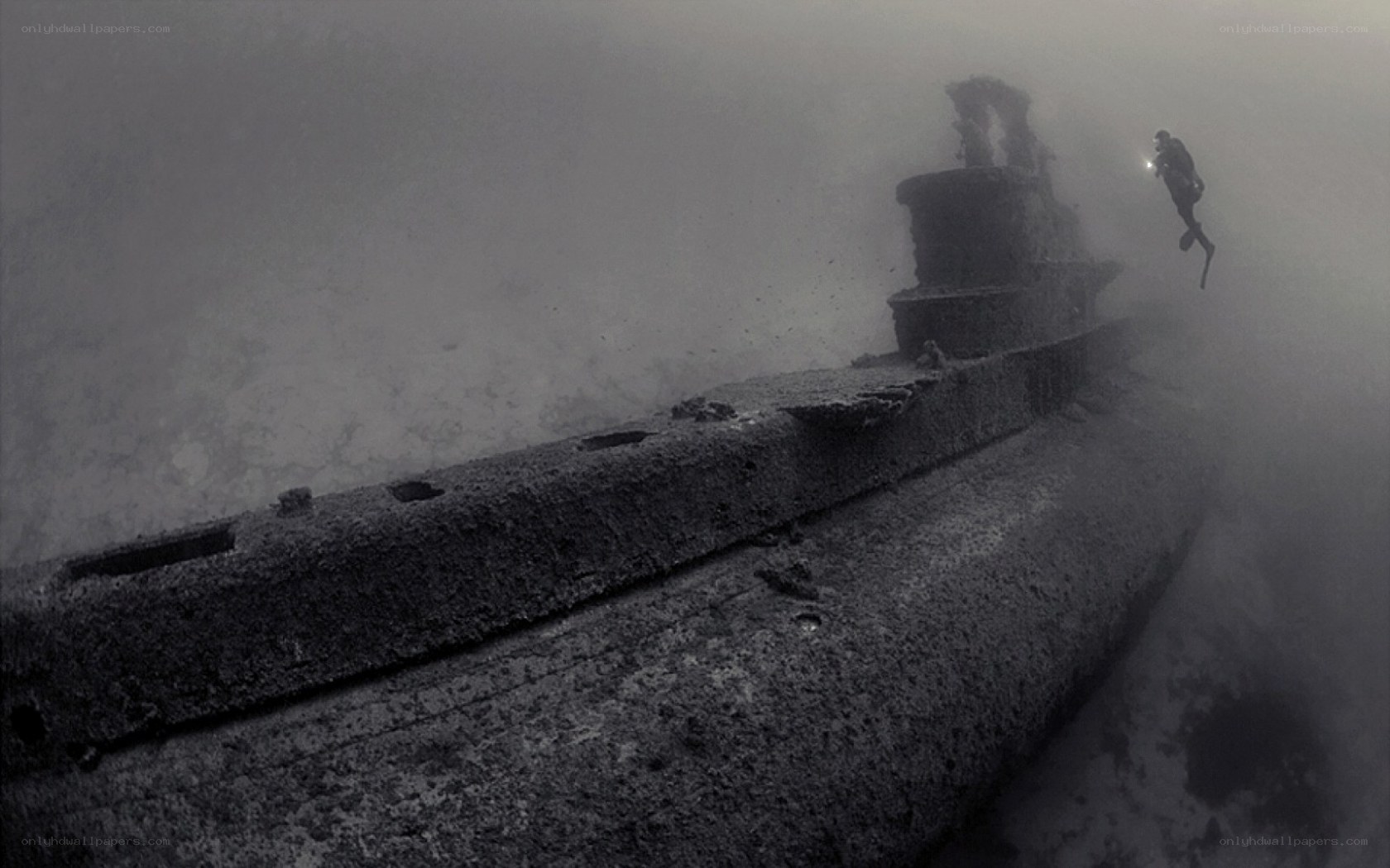 Diver explores sunken submarine