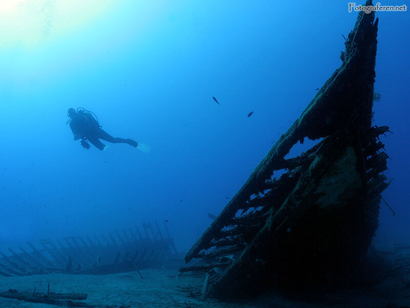 Diver exploring shipwreck