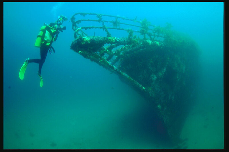 Diver exploring shipwreck