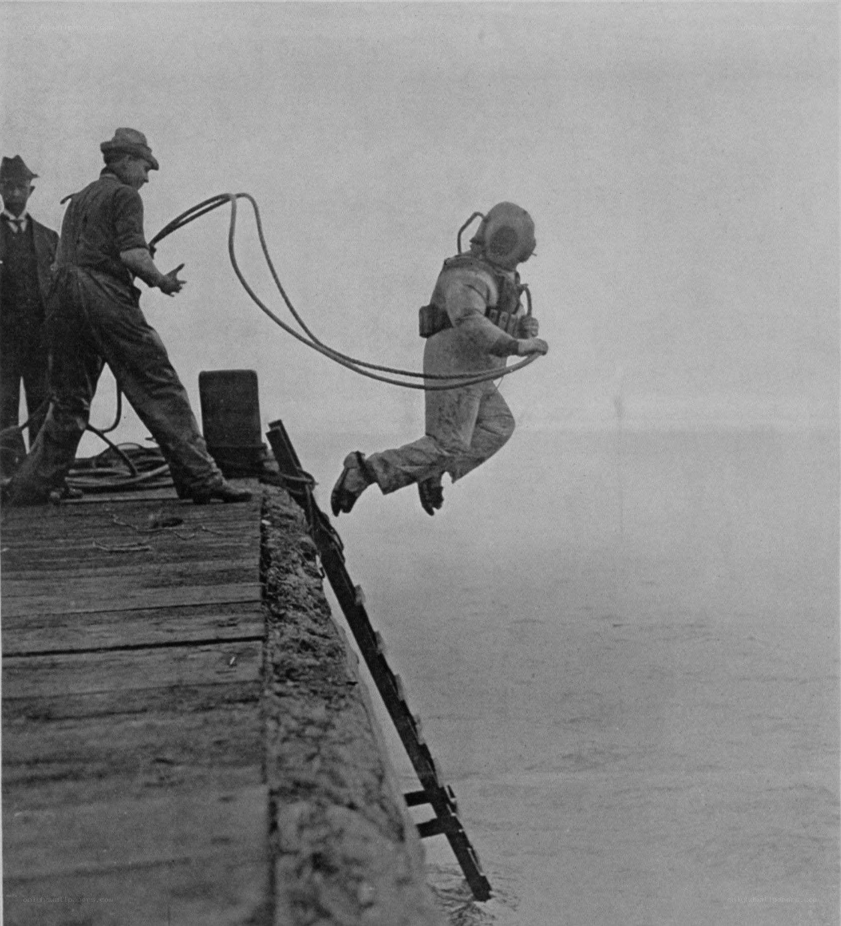 diver jumping from dock