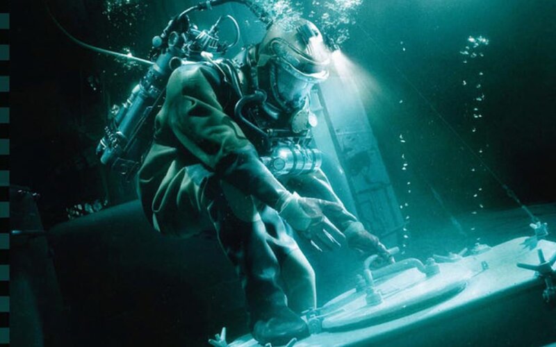 diver underwater at night