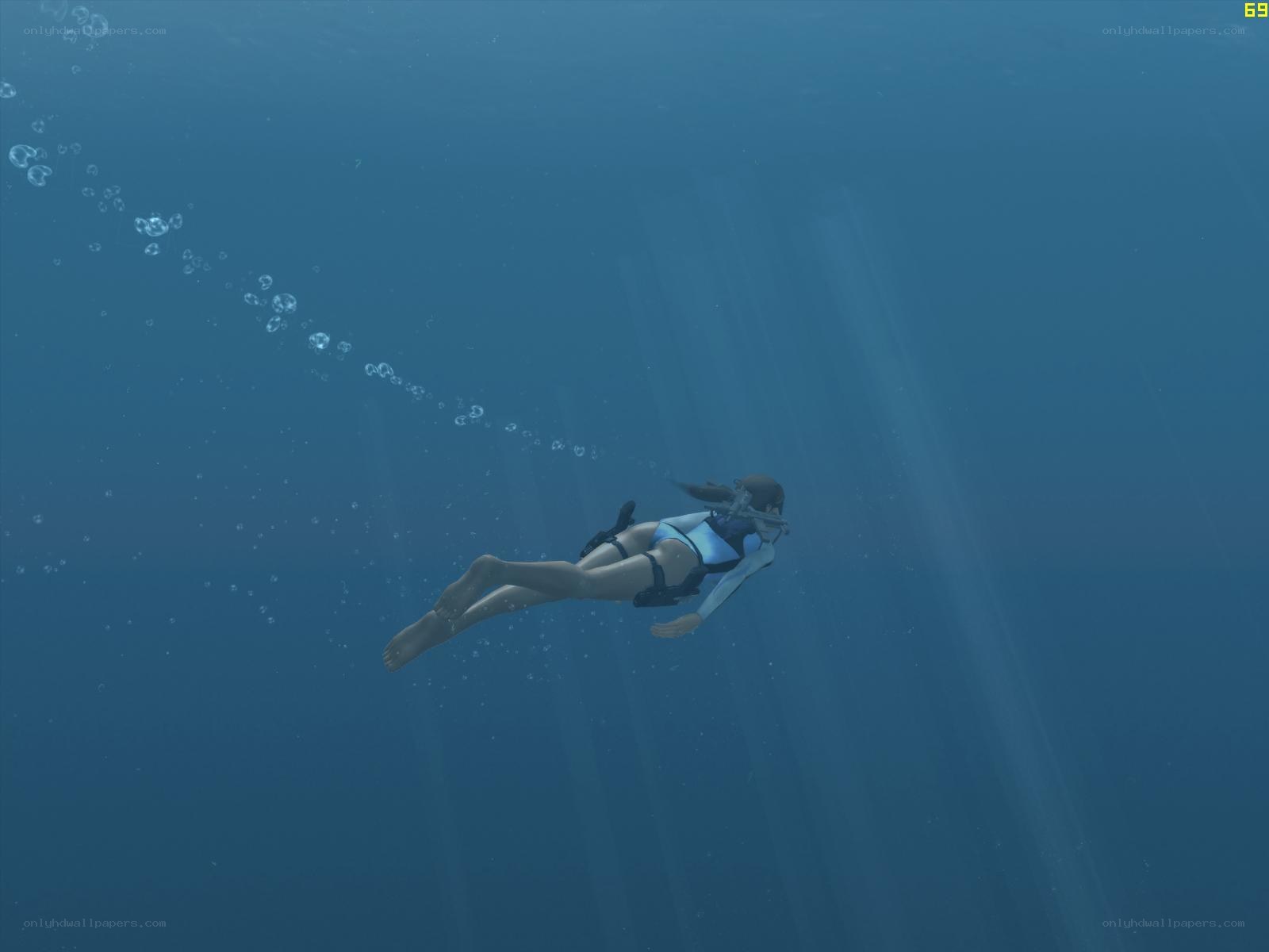 diver underwater in blue water